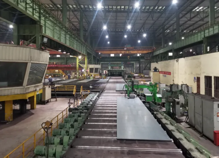 A36 steel plate production line at MWAlloys factory showing hot rolled steel plate manufacturing process for structural applications.